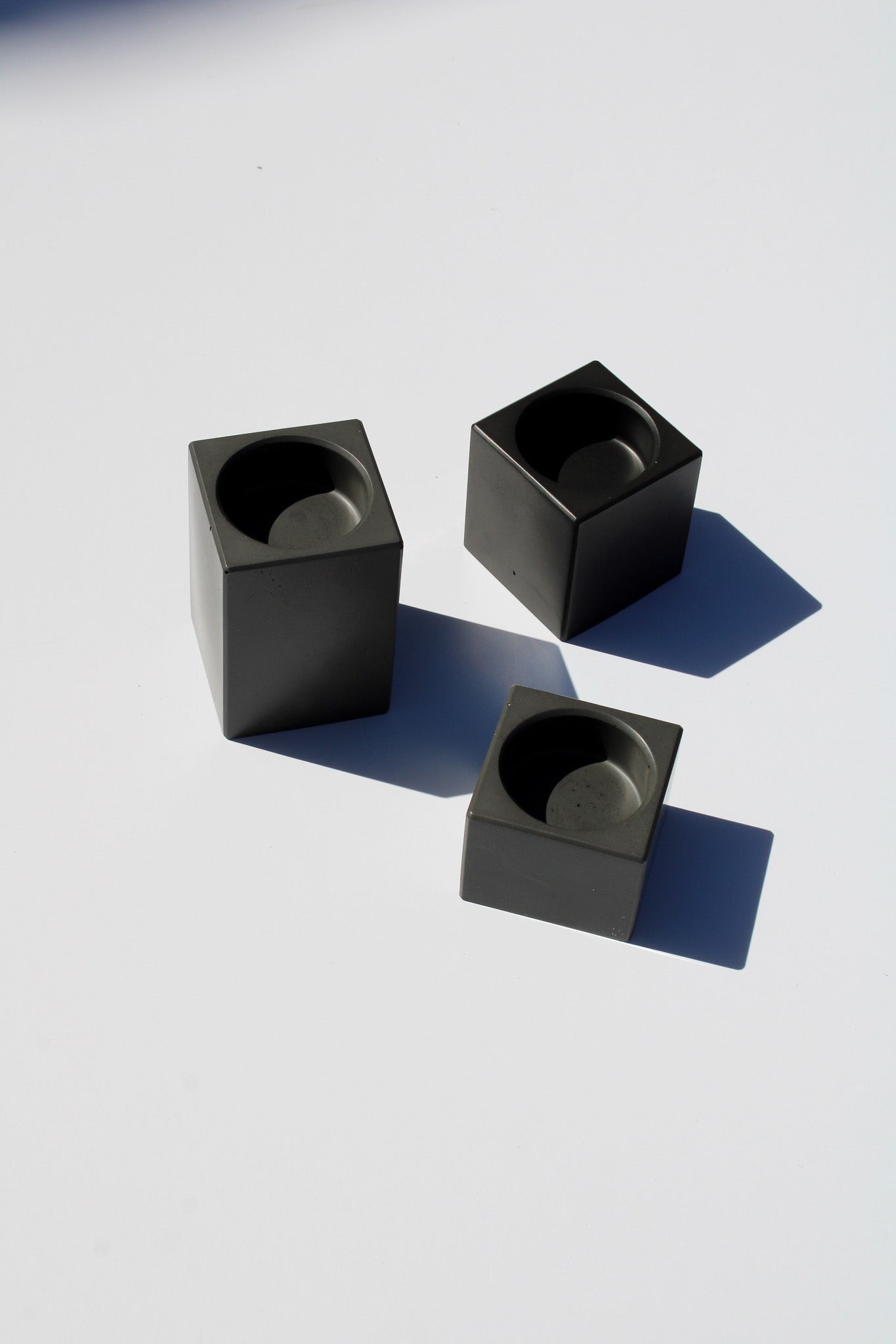 Set of 3 handmade rectangular tealight holders in grey minimalist decor ideal for modern interiors.