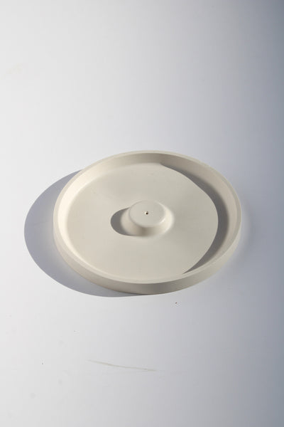 Minimalist incense holder with smooth round shape—perfect decorative accent for serene, modern home decor.
