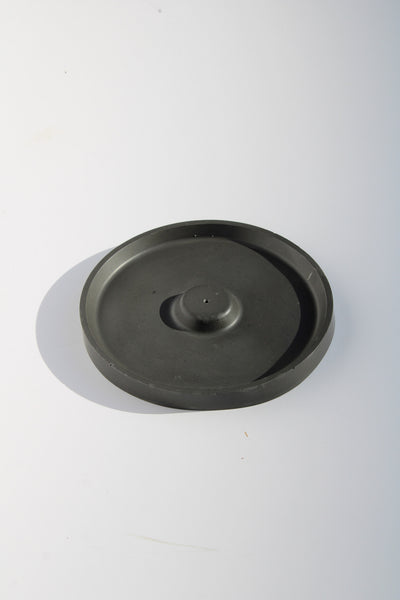 Round incense holder with minimalist design—ideal for burning incense sticks in modern or zen-inspired interiors.